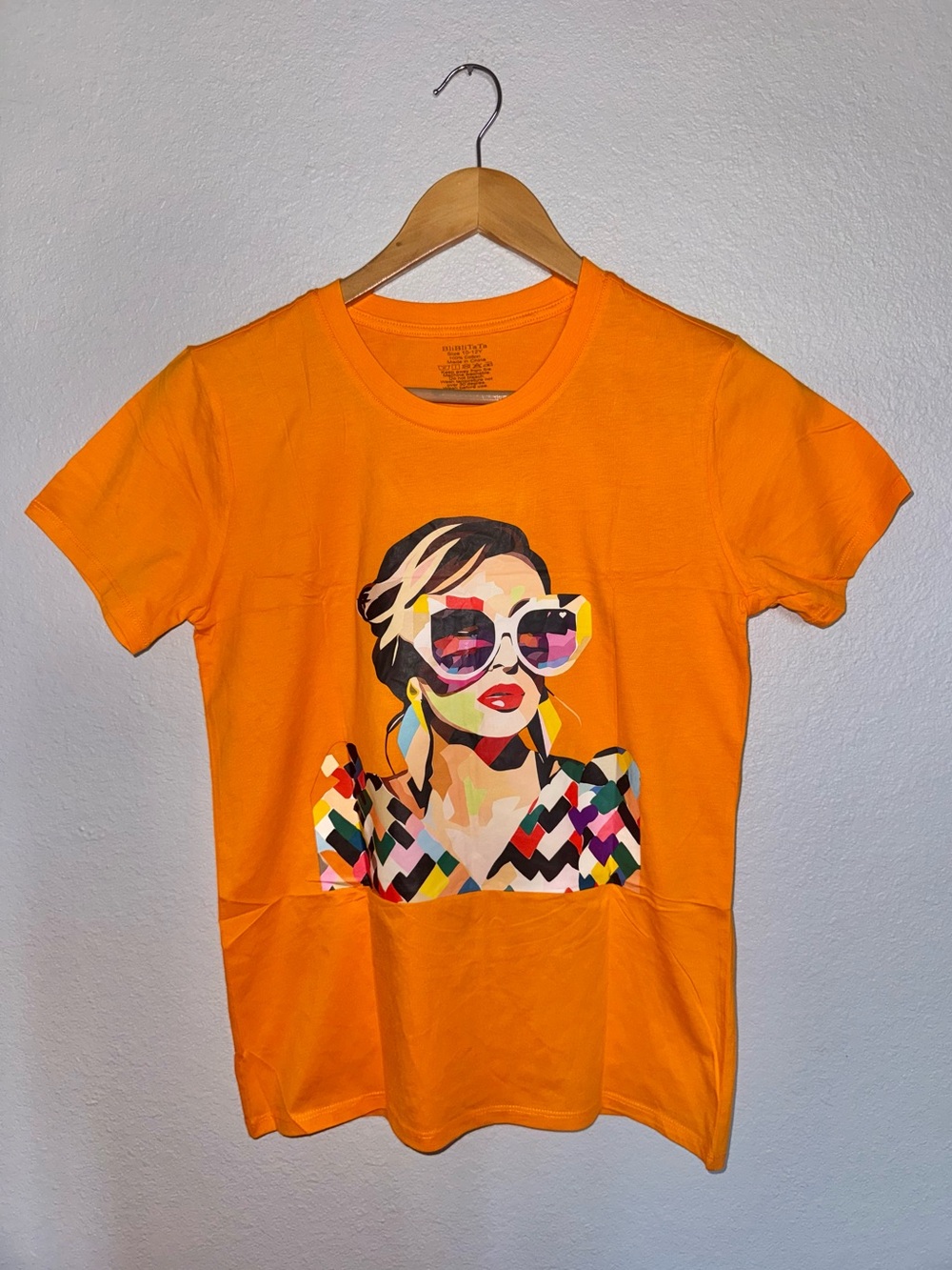 New Kids Orange cotton graphic tee w/ woman wearing sunglasses Size 10-12Y